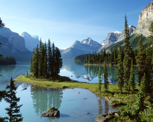 Luxury train moving through the Canadian Rocky Mountains.